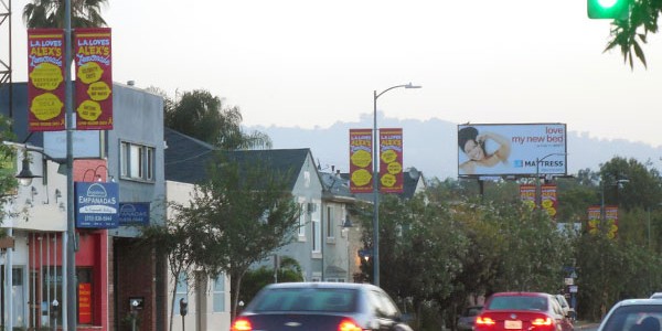 city light pole banner campaign supports cancer charity